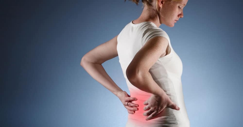 Woman experiencing lower back pain